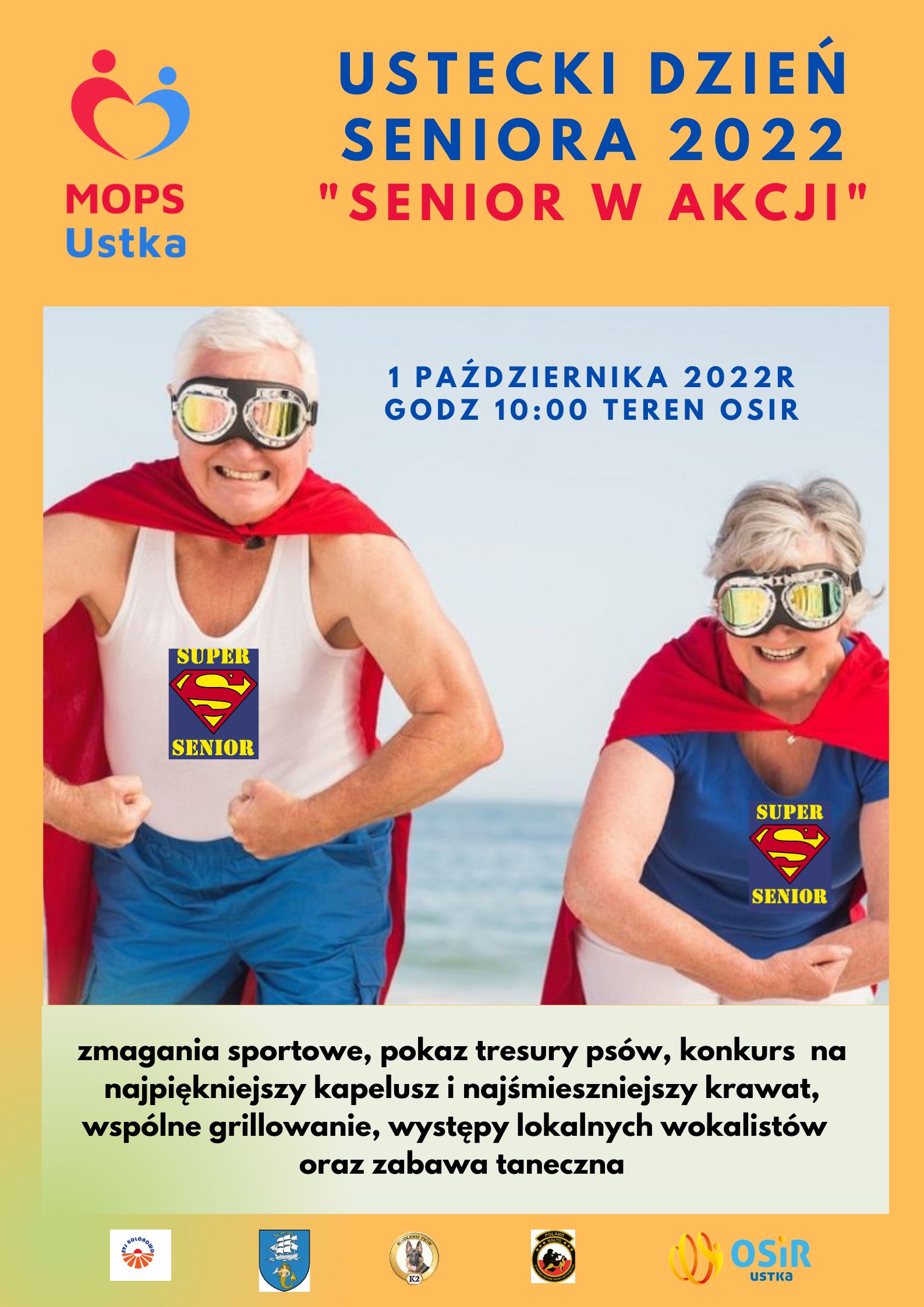 Seniorzy w czerwonych pelerynach z goglami na oczach